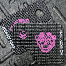 Load image into Gallery viewer, Deceitful Strength Monkey Grips. Crossfit and fitness hand grips for pull ups, deadlifts, kettlebells, dumbbells. The Standard pink design. Single pink monkey face logo on black grips.